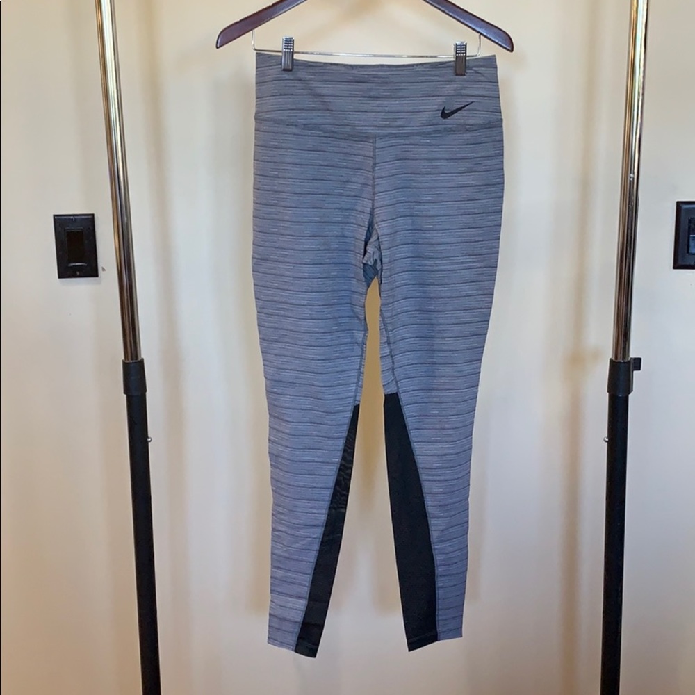 Grey Nike training leggings with mesh panels